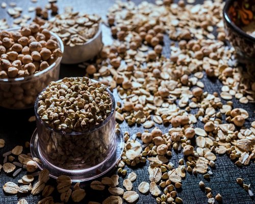 A variety of colorful seasonal legumes and grains inside a domestic kitchen
