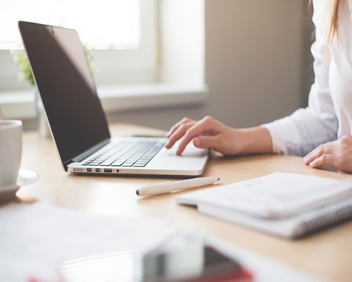 A relaxed workspace near a window with natural ambient light